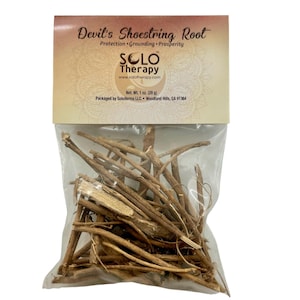 May include: A clear plastic bag containing brown Devil's Shoestring Root pieces. The header card features the text Devil's Shoestring Root, Protection, Grounding, Prosperity, Solo Therapy, and Net. Wt. 1 oz. (28 g) with a mandala-style background design.