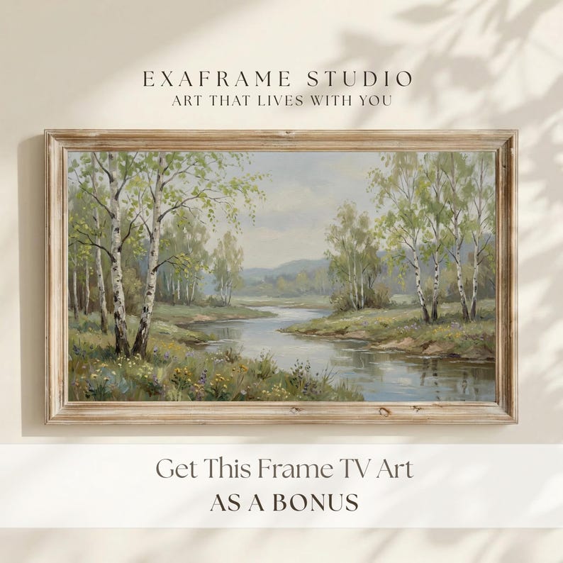 A serene bonus artwork showcasing a tranquil birch forest river landscape framed in rustic weathered wood, displayed on a clean neutral wall with soft window shadows. This complementary piece included in every order features gentle impressionist tree textures and a peaceful water stream. Designed to complete your seasonal screen collection with sophisticated country charm. Click to access your instant digital download files.