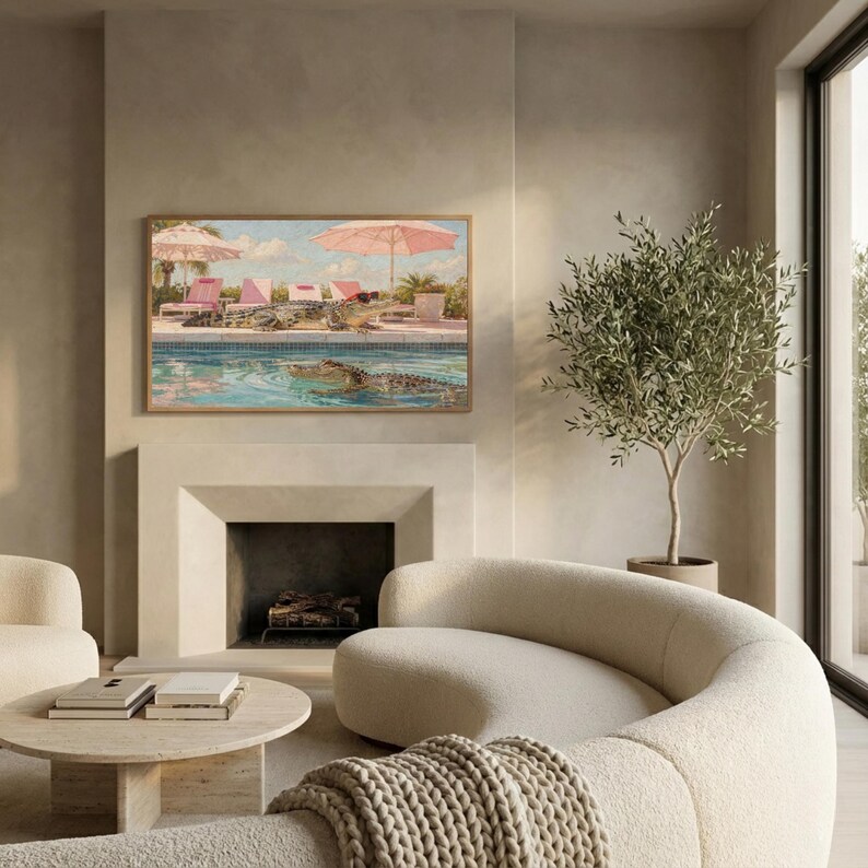 A sophisticated view of a modern living room featuring a sculpted stone fireplace and a luxurious curved sofa. Above the hearth, the Samsung Frame TV displays the funny Palm Springs alligator pool art, perfectly bridging the gap between quirky humor and high-end design. The neutral stone tones emphasize the vibrant pink and turquoise of the painting. Redefine your screen's vibe with this iconic mid-century modern aesthetic—download now.
