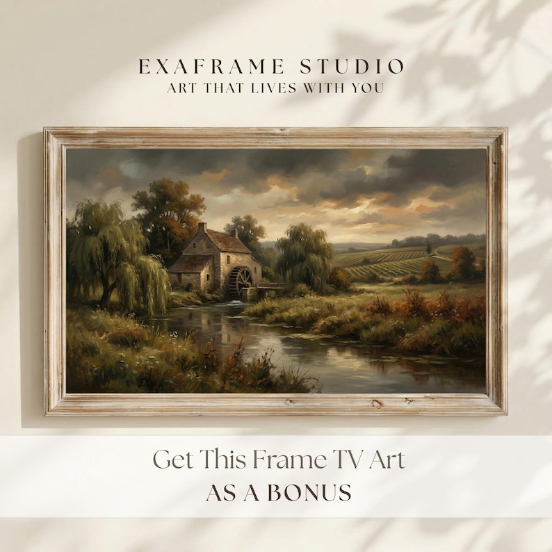 Promotional mockup showing the exclusive Bonus Frame TV Art offer featuring a vintage watermill landscape painting in a rustic wood frame. The scene is illuminated by soft sunlight and leaf shadows on a neutral wall, highlighting the digital download bundle value for ExaFrame Studio customers. Perfect for those looking to complete their gallery wall with matching 4K and 8K UHD television backgrounds... — available now with limited-time discount.