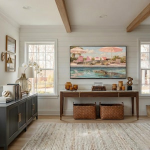 A cinematic view of a bright, airy living room with white shiplap walls and a wooden console table. Centered on the wall, a Samsung Frame TV displays the funny Palm Springs crocodile art, perfectly complementing the mid-century modern aesthetic. The natural light highlights the painting’s vibrant pinks and turquoise blues, creating a cheerful atmosphere. Elevate your home’s personality today—click to download this high-resolution digital art instantly.