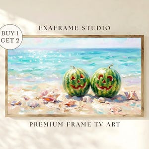 May include: A framed digital art print titled EXAFRAME STUDIO PREMIUM FRAME TV ART featuring two carved watermelon jack-o'-lanterns sitting on a sandy beach with seashells near turquoise ocean waves under a bright sky. Includes a BUY 1 GET 2 badge.