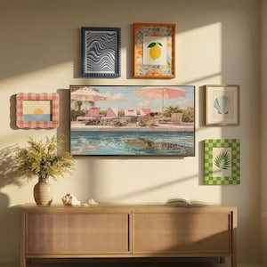 An inspiring gallery wall setup featuring the funny Palm Springs alligator art as the central piece on a Samsung Frame TV. Surrounded by smaller colorful prints like lemons and seashells, this arrangement showcases how quirky animal art can blend into a curated maximalist decor. The warm lighting and woven textures on the sideboard create a cozy, eclectic atmosphere. Make your living room stand out with this unique digital art collection today.