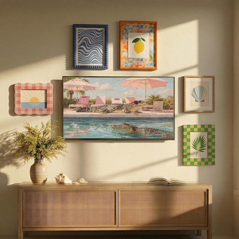 An inspiring gallery wall setup featuring the funny Palm Springs alligator art as the central piece on a Samsung Frame TV. Surrounded by smaller colorful prints like lemons and seashells, this arrangement showcases how quirky animal art can blend into a curated maximalist decor. The warm lighting and woven textures on the sideboard create a cozy, eclectic atmosphere. Make your living room stand out with this unique digital art collection today.
