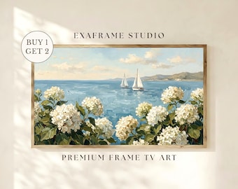 May include: A framed landscape painting featuring a serene seascape with two sailboats on a blue ocean. White hydrangea flowers frame the bottom of the painting. The text "EXAFRAME STUDIO" and "PREMIUM FRAME TV ART" are visible.