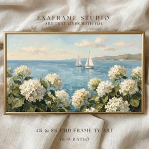 A professional 16:9 ratio display of the Nantucket seaside art, shown in a bright and modern home setting. The horizontal composition of sailboats and hydrangeas perfectly fits the Samsung Frame TV screen, creating a seamless window to the ocean. The balanced colors of "Cloud Dancer" white and "Cool Blue" add a restorative energy to the room's atmosphere. Bring the airy optimism of summer to your screen—click to download instantly.