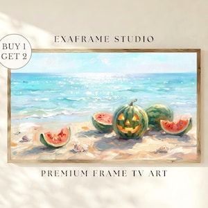 May include: A rectangular framed digital art print titled EXAFRAME STUDIO PREMIUM FRAME TV ART featuring a beach scene with a carved jack-o'-lantern watermelon and sliced watermelon pieces on the sand, with the text BUY 1 GET 2 visible.