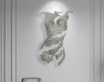 Silver wall sculpture of a female torso, a 3D hand-welded iron figure, hanging wall decoration