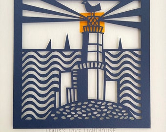 May include: A square navy blue paper cutout featuring a lighthouse with a bird perched on top, set against a yellow sun. The design includes wavy water patterns, distant sailboats, and the text "LEWIS'S LOVE LIGHTHOUSE" printed at the bottom.