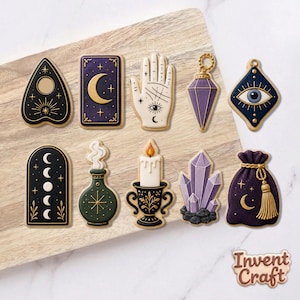 May include: A collection of nine decorated cookies featuring mystical shapes including a planchette, a crescent moon card, a palmistry hand, a purple crystal pendant, an eye, moon phases, a potion bottle, a candle, and a purple pouch with the text Invent Craft.