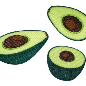 May include: Three embroidered avocado patches with green and brown stitching. The avocados are cut in half and show the seed inside.