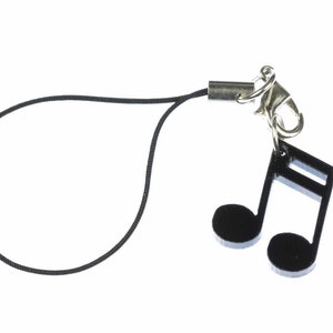 Peut inclure: Breloque de téléphone noir avec un charme de note de musique noire.