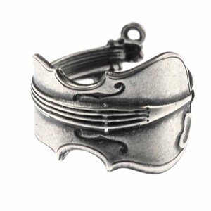 May include: A silver-toned ring shaped like a cello. The ring is detailed with the strings and f-holes of the instrument.