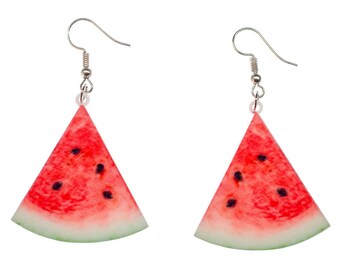 May include: A pair of watermelon slice earrings with silver hooks. The earrings are made of red, green, and black plastic and feature a realistic watermelon slice design.