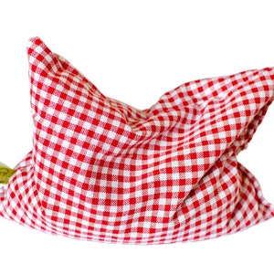 May include: Red and white gingham fabric pillow with a green tag.