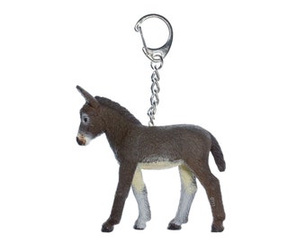 May include: A brown and white donkey figurine keychain. The donkey is standing on all four legs and has a silver chain attached to its back.