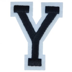 Könnte beinhalten: Schwarzer Filzbuchstabe Y mit weißem Umriss. Der Buchstabe ist ein Großbuchstabe und hat einen klassischen Stil.
