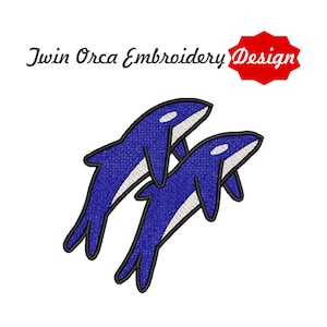 May include: Twin Orca Embroidery Design. Two blue orca whales with white bellies and black outlines are featured. The design is set against a white background. A red starburst shape with the words "Twin Orca Embroidery Design" is in the upper right corner.