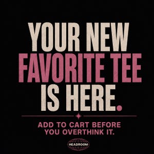 May include: A black graphic design featuring the text YOUR NEW FAVORITE TEE IS HERE in large beige and pink letters. Below, smaller text reads ADD TO CART BEFORE YOU OVERTHINK IT, followed by a small star icon and the word HEADROOM inside an oval.