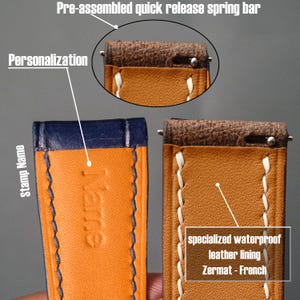 K&ouml;nnte beinhalten: Nahaufnahme von zwei Lederarmb&auml;ndern. Eines ist orange mit blauem Akzent und dem gepr&auml;gten Wort "Name". Das andere ist orange mit wei&szlig;en N&auml;hten und dem Text "specialized waterproof leather lining Zermat - French". Beide haben vorgefertigte Schnellverschluss-Federstege.