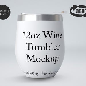 May include: A white 12oz wine tumbler mockup with a silver rim and a clear lid. The text "12oz Wine Tumbler Mockup" is printed in black. A 360-degree arrow graphic is in the upper right corner.