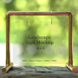 Puede incluir: Un soporte de metal color cobre con un panel acrílico transparente. El soporte está diseñado para mostrar un letrero horizontal de 25,4 cm por 20,3 cm. El texto "Landscape Sign Mockup" es visible en el panel.