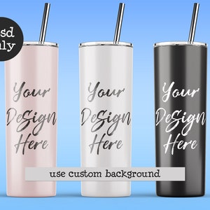 May include: Three stainless steel tumblers with lids and straws. The tumblers are pink, white, and black. Each tumbler has the text "Your Design Here" printed on the side.