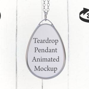 May include: A silver teardrop pendant mockup with a white background. The pendant is hanging from a silver chain. The text "Teardrop Pendant Animated Mockup" is written on the pendant.