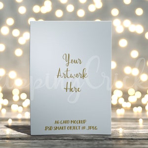 Download A6 card mockup on worn wooden floorboards smart object ...