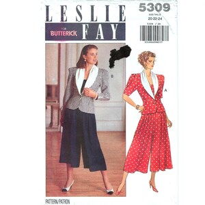 May include: A vintage sewing pattern for a Leslie Fay suit. The pattern features two suit designs: one with a black and white checkered blazer and navy culottes, and another with a red polka dot suit. The pattern size is 20-22-24.