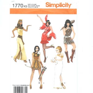 May include: Simplicity pattern 1770 K5 featuring illustrations of five different costume designs. The costumes include a Cleopatra-style dress, a flapper dress, a cavewoman outfit, a Native American-inspired outfit, and a Greek goddess dress.