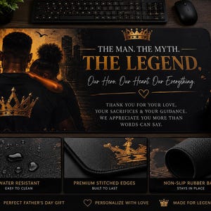 May include: A rectangular black desk mat featuring a gold crown graphic and the text THE MAN. THE MYTH. THE LEGEND. OUR HERO. OUR HEART. OUR EVERYTHING. THANK YOU FOR YOUR LOVE, YOUR SACRIFICES & YOUR GUIDANCE. WE APPRECIATE YOU MORE THAN WORDS CAN SAY.