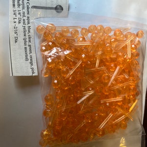 May include: A bag of 9 colors of small plastic Christmas lights. The lights are 1/4 inch in diameter and have a 3/4 inch stem. The colors are aqua, blue, clear, green, orange, pink, purple, red, and yellow.