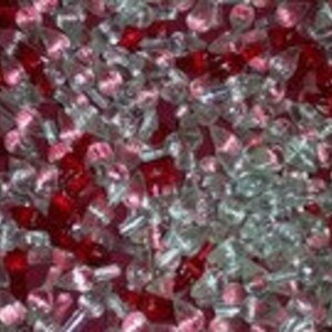 May include: A large assortment of clear and red glass Christmas light bulbs. The bulbs are small and have a pointed tip.