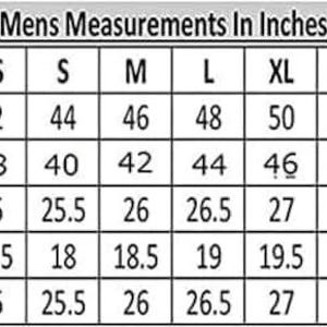 May include: A chart displaying men's measurements in inches for various sizes, from XXS to 5XL. Measurements include chest, waist, sleeves, shoulders, and length, with corresponding inch values for each size. The text "Mens Measurements In Inches" is at the top.