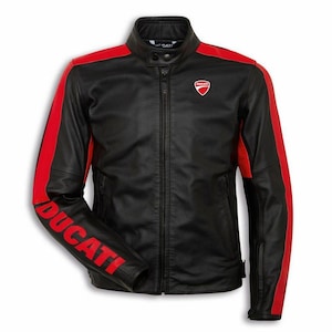 May include: Black leather jacket with red stripes on the shoulders and sleeves. The jacket displays the word "DUCATI" in red on the left sleeve and a Ducati logo on the chest. It has a stand-up collar and a full-length zip.