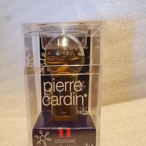 Pierre Cardin Pour Monsieur by Pierre Cardin 5/8 oz eau de cologne New, great travel size a Woody Spicy fragrance for men. Launched in 1972.