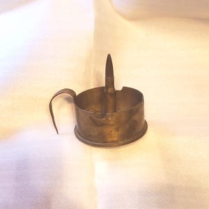 TRENCH ART ASHTRAY constructed of Part of a 105 MMM14 shell casing and a bullet casing World War 2 era, brass. 4.5 in. diameter plus handle