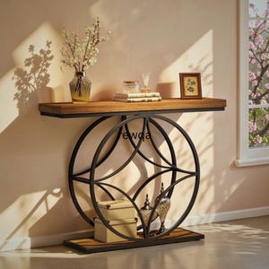 May include: A contemporary console table with a dark wood surface and a black metal geometric base. The table has a lower shelf and is adorned with a vase of flowers, books, and decorative items. The text "fewqa" is visible on the table.