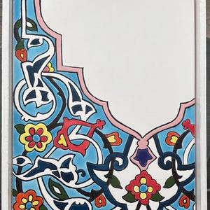 May include: White wooden serving tray with a colorful, ornate tile design. The tile features a blue background with floral and arabesque patterns in red, yellow, and white. The tray has a handle and decorative metal corners.