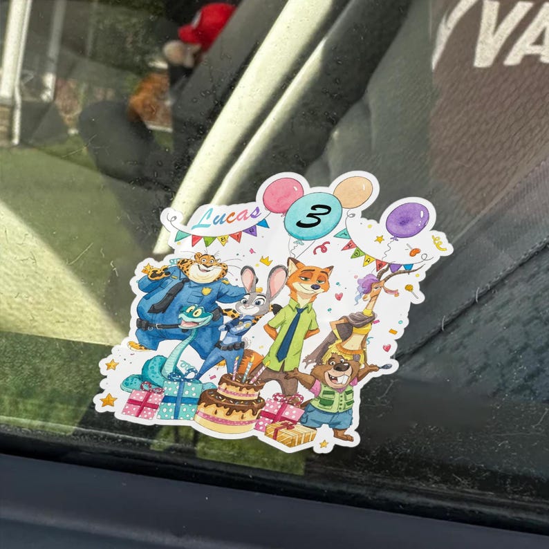 May include: A Zootopia-themed sticker featuring characters Judy Hopps, Nick Wilde, Chief Bogo, Flash, and others. The design includes a birthday cake, colourful balloons, and bunting with the text Lucas and the number 3 printed at the top.