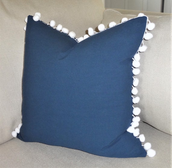 Navy pom top pom pillow