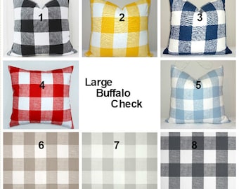 May include: Eight different large buffalo check pillow covers in various colors, including black and white, yellow and white, blue and white, red and white, light blue and white, gray and white, beige and white, and gray and white. The pillow covers are arranged in a grid pattern with the numbers 1 through 8 in the top corner of each pillow cover.