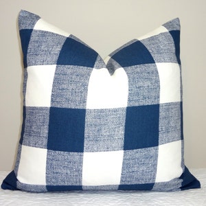 May include: A blue and white checked throw pillow with a woven texture.