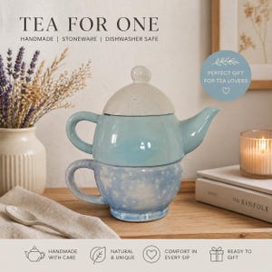 May include: A blue and white ceramic tea for one set. The teapot has a light blue body and a speckled white lid. The cup below is light blue with white speckles. Text on the image reads "TEA FOR ONE" and "HANDMADE | STONEWARE | DISHWASHER SAFE".