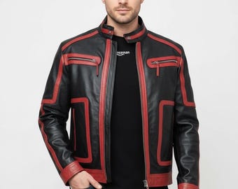 May include: Black leather jacket with red accents, including stripes along the seams and around the cuffs. Features a stand-up collar, zippered pockets, and a front zipper closure. The jacket is worn over a black t-shirt and blue jeans.
