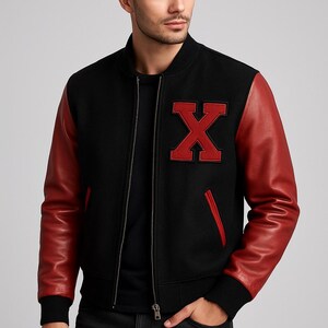May include: Black bomber jacket with red leather sleeves. The jacket features a large red letter "X" patch on the chest and a red accent on the pocket. The jacket has a black ribbed collar, cuffs, and hem, and a silver zipper closure.