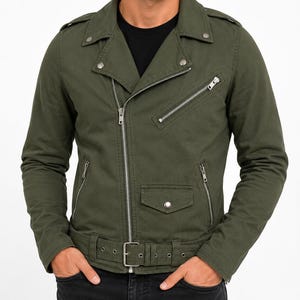 May include: An olive green motorcycle-style jacket featuring a diagonal front zipper, a notched lapel with silver-tone snaps, a slanted chest pocket, two lower side pockets with zippers, a small flap pocket, and an adjustable waist belt.