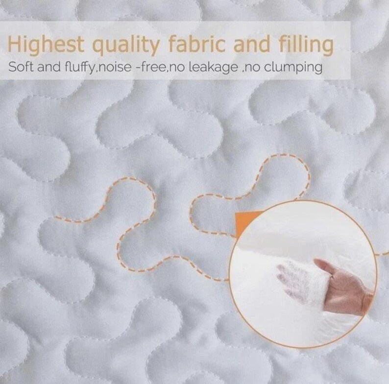 May include: Close-up of a white quilted fabric with a wavy pattern and orange stitching. The text reads "Highest quality fabric and filling" and "Soft and fluffy, noise-free, no leakage, no clumping". A hand holds a sample of the filling.