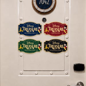 May include: Four rectangular decorative signs with rounded corners and scalloped edges, featuring the Disney Treasure logo, Pluto, and Mickey Mouse. The signs are in blue, red, green, and black, displaying custom text like The Parker Party and Room 8628.